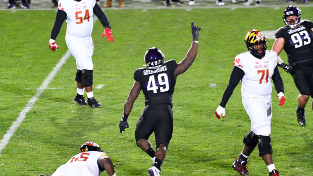 Northwestern Wildcats defensive lineman Adetomiwa Adebawore (49) celebrates his sack against the Maryland Terrapins during the second half at Ryan Field. David Banks-USA TODAY Sports